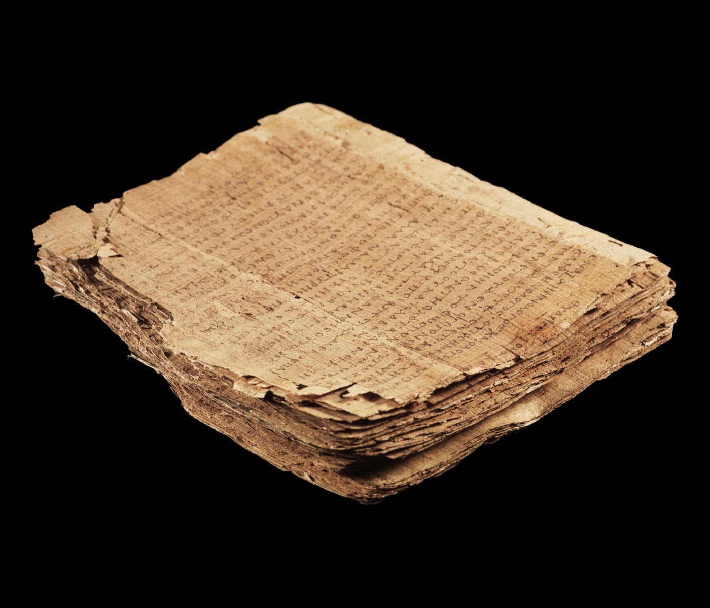 The stacked papyrus leaves of Papyrus 66 with the opening page of the Gospel of John on top